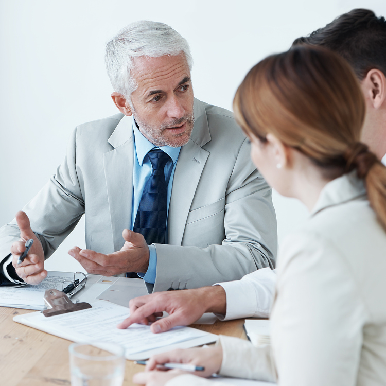 Person guiding two colleagues through R&D tax credit steps